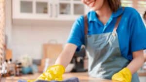 Maid Cleaning a Kitchen countertop